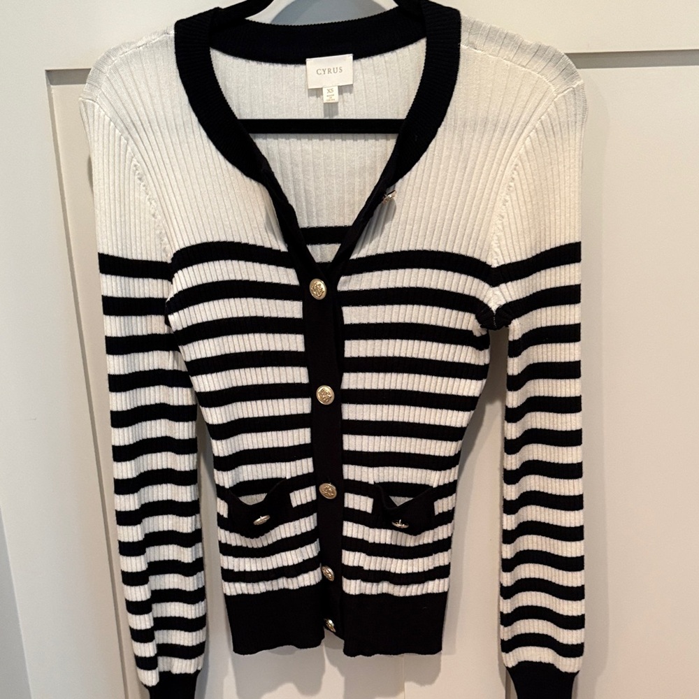Black and white striped knit sweater size extra small brand is  Cyrus